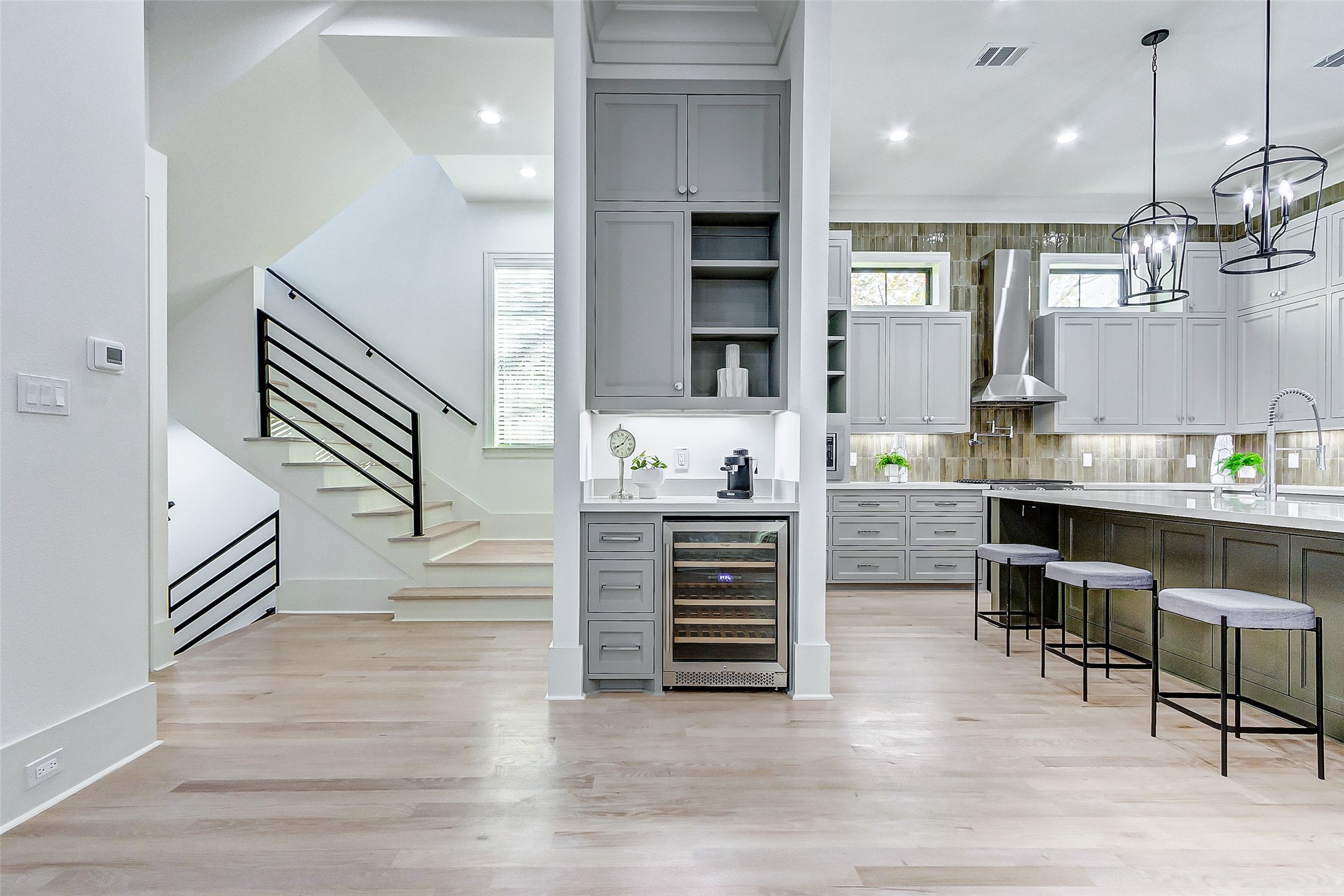 2122 Blalock Road, Unit B Houston, TX 77080 - Photo 17 of 48 a room with stainless steel appliances kitchen island furniture and wooden floor