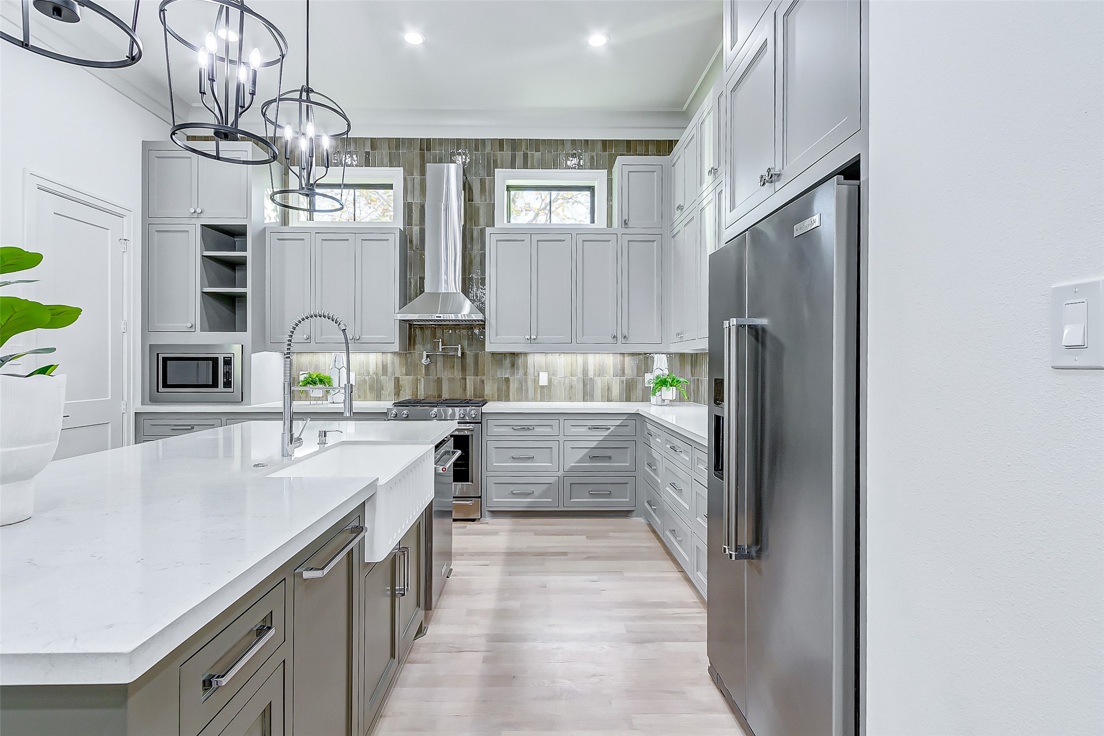 2122 Blalock Road, Unit B Houston, TX 77080 - Photo 21 of 48 a kitchen with stainless steel appliances kitchen island granite countertop a refrigerator and a sink