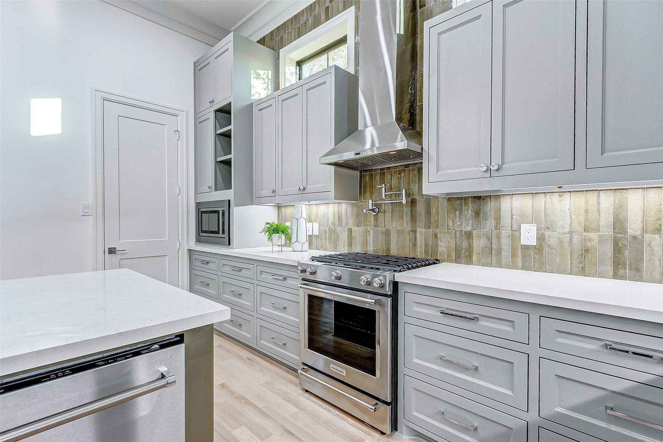 2122 Blalock Road, Unit B Houston, TX 77080 - Photo 23 of 48 a kitchen with stainless steel appliances white cabinets and a stove top oven