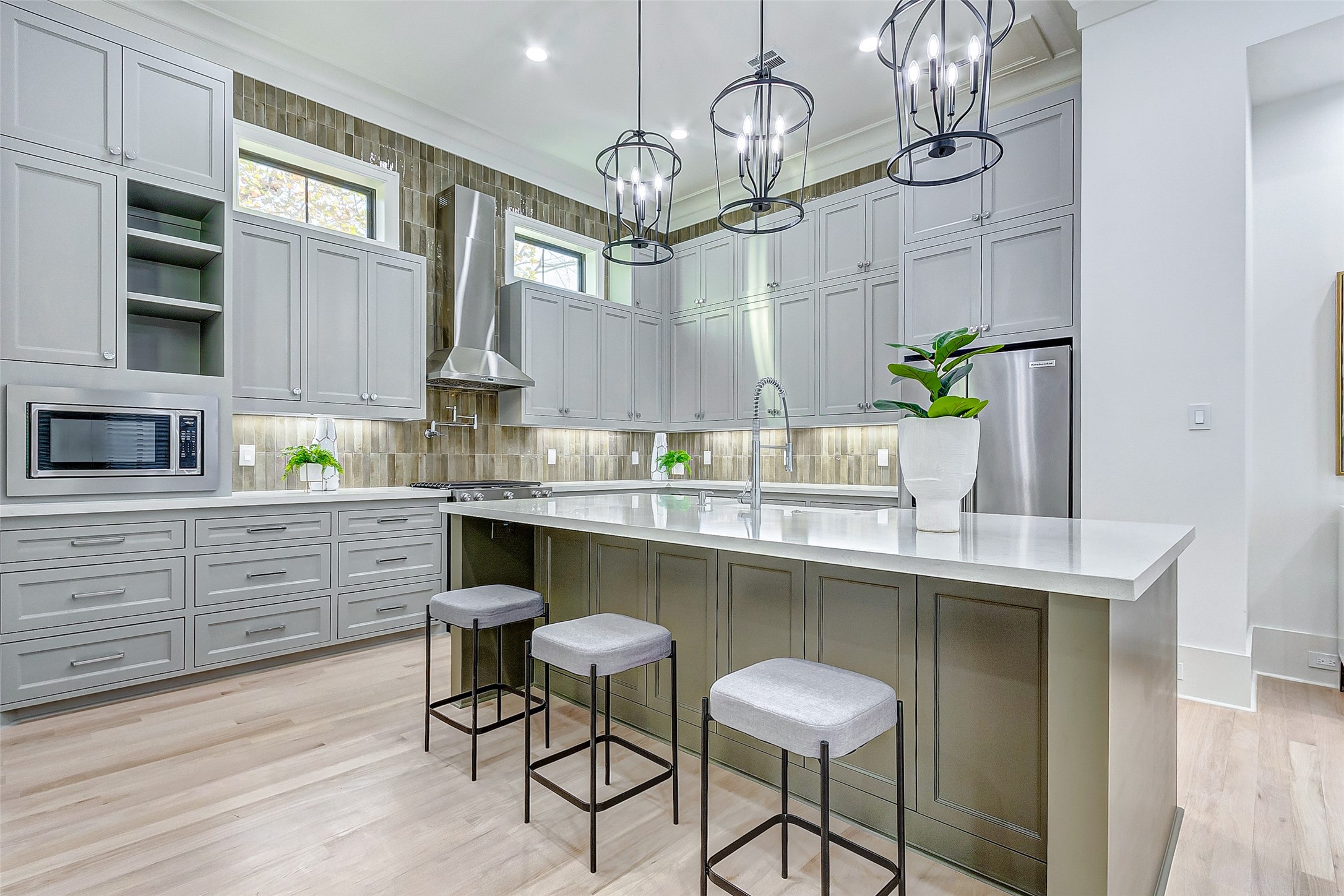 2122 Blalock Road, Unit B Houston, TX 77080 - Photo 26 of 48 a kitchen with a table chairs cabinets and wooden floor