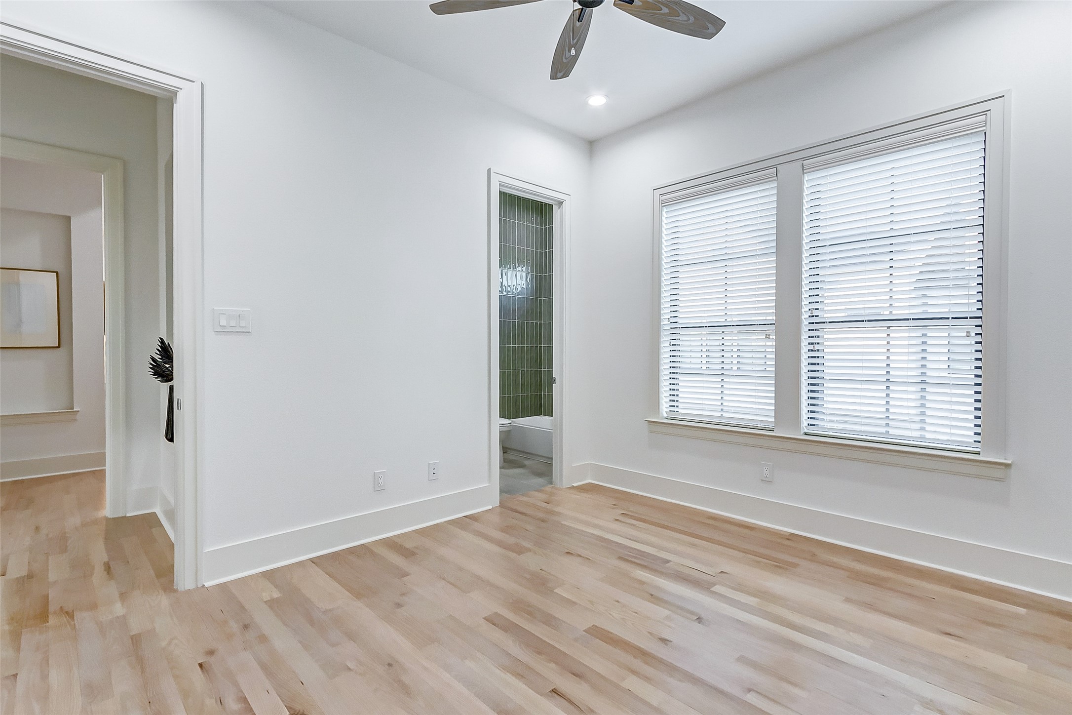 2122 Blalock Road, Unit B Houston, TX 77080 - Photo 29 of 48 a view of an empty room with wooden floor and a window
