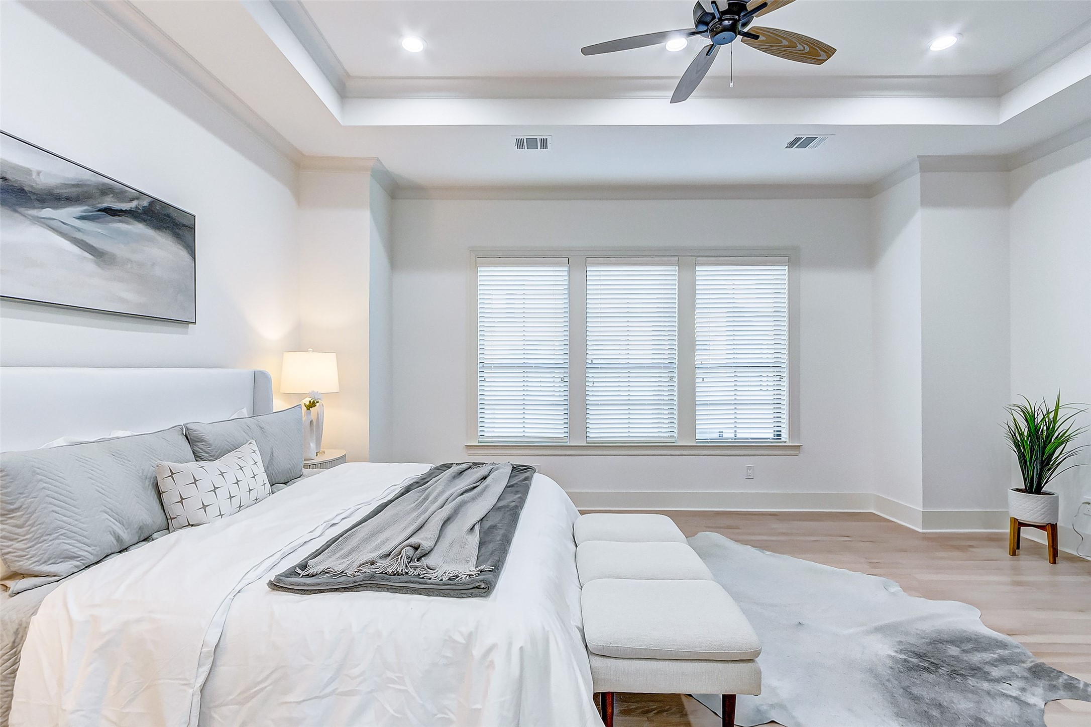 2122 Blalock Road, Unit B Houston, TX 77080 - Photo 36 of 48 a bedroom with a bed a couch and a potted plant