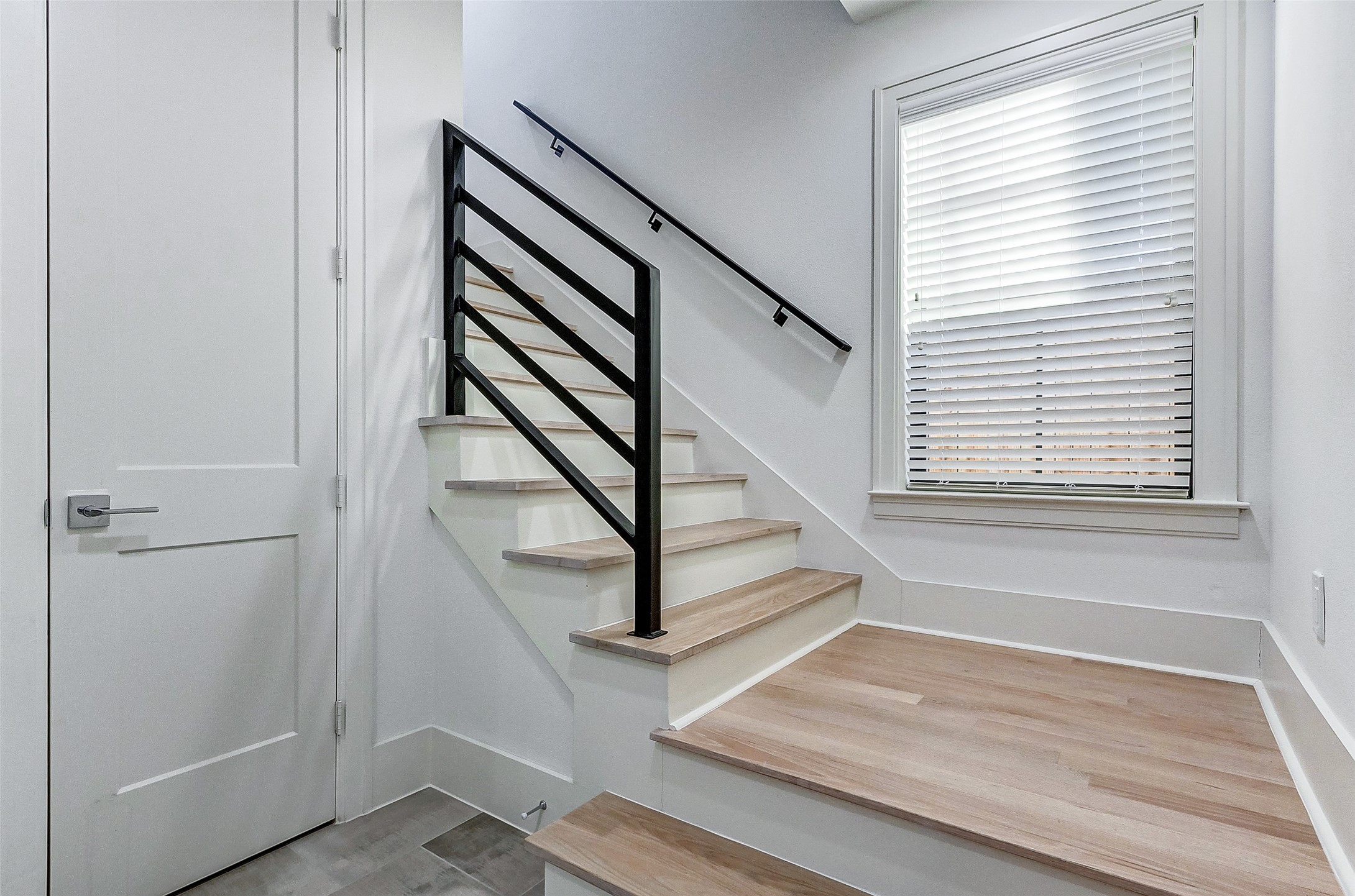 2122 Blalock Road, Unit B Houston, TX 77080 - Photo 9 of 48 a view of entryway with wooden floor and stairs
