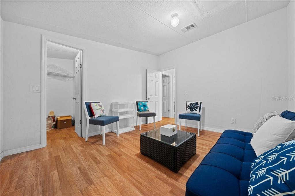 13120 Southwest 90th Street Dunnellon, FL 34432 - Photo 12 of 24 a living room with furniture and wooden floor