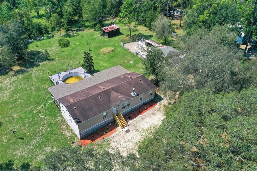 13120 Southwest 90th Street Dunnellon, FL 34432 - Photo 24 of 24 an aerial view of a house with a yard