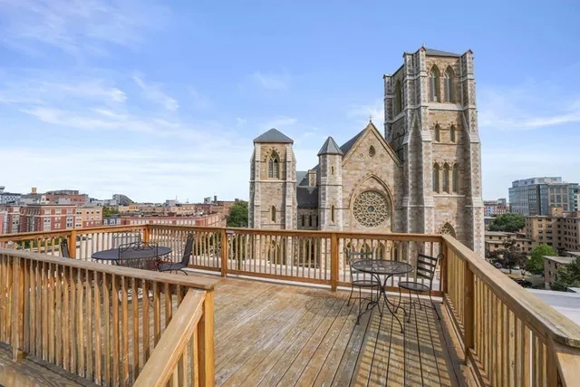 a view of a balcony with wooden floor