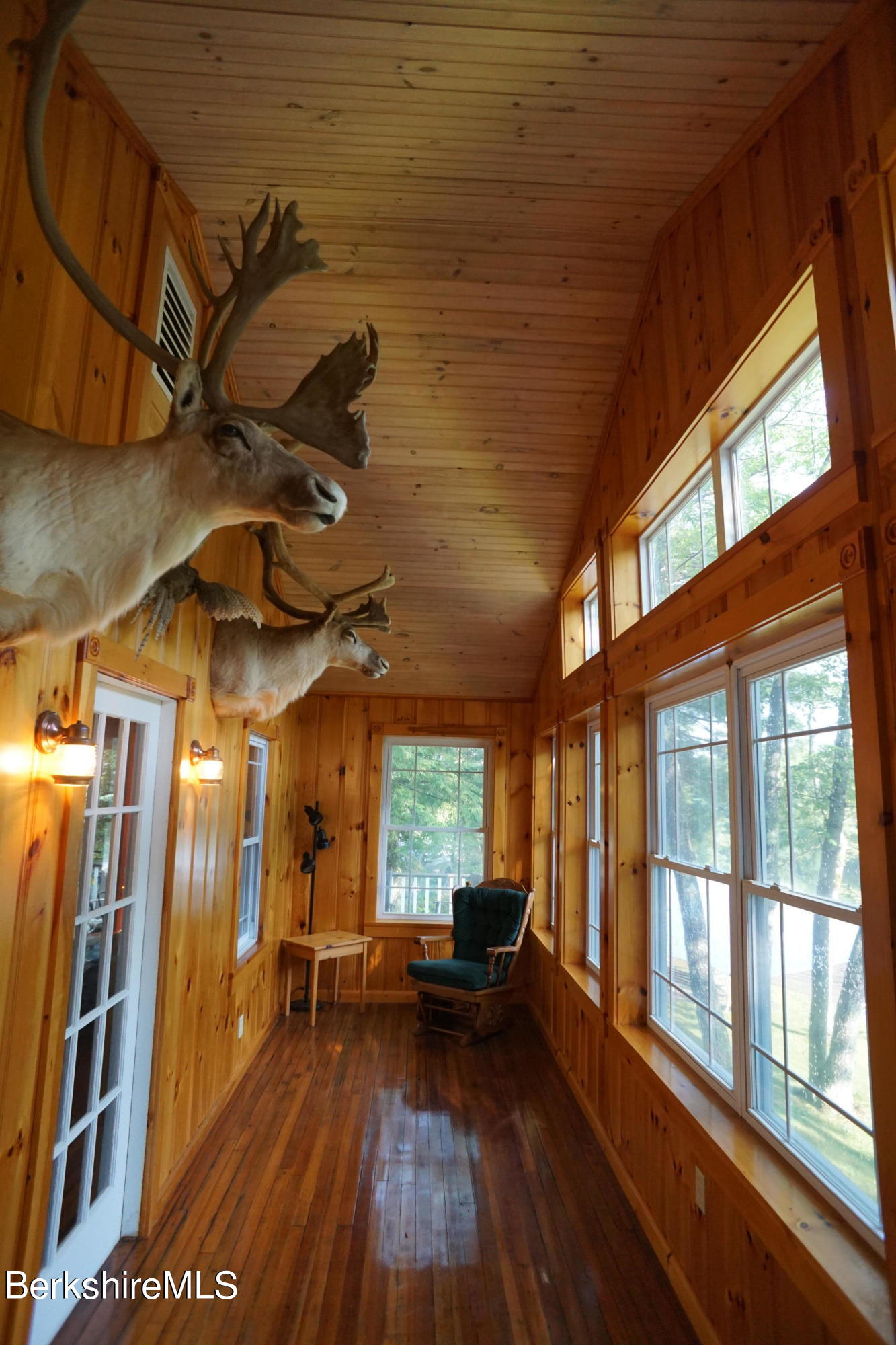5 South Gate Island Road Otis, MA 01029 - Photo 12 of 38 a view of a room with lots of wooden furniture and windows