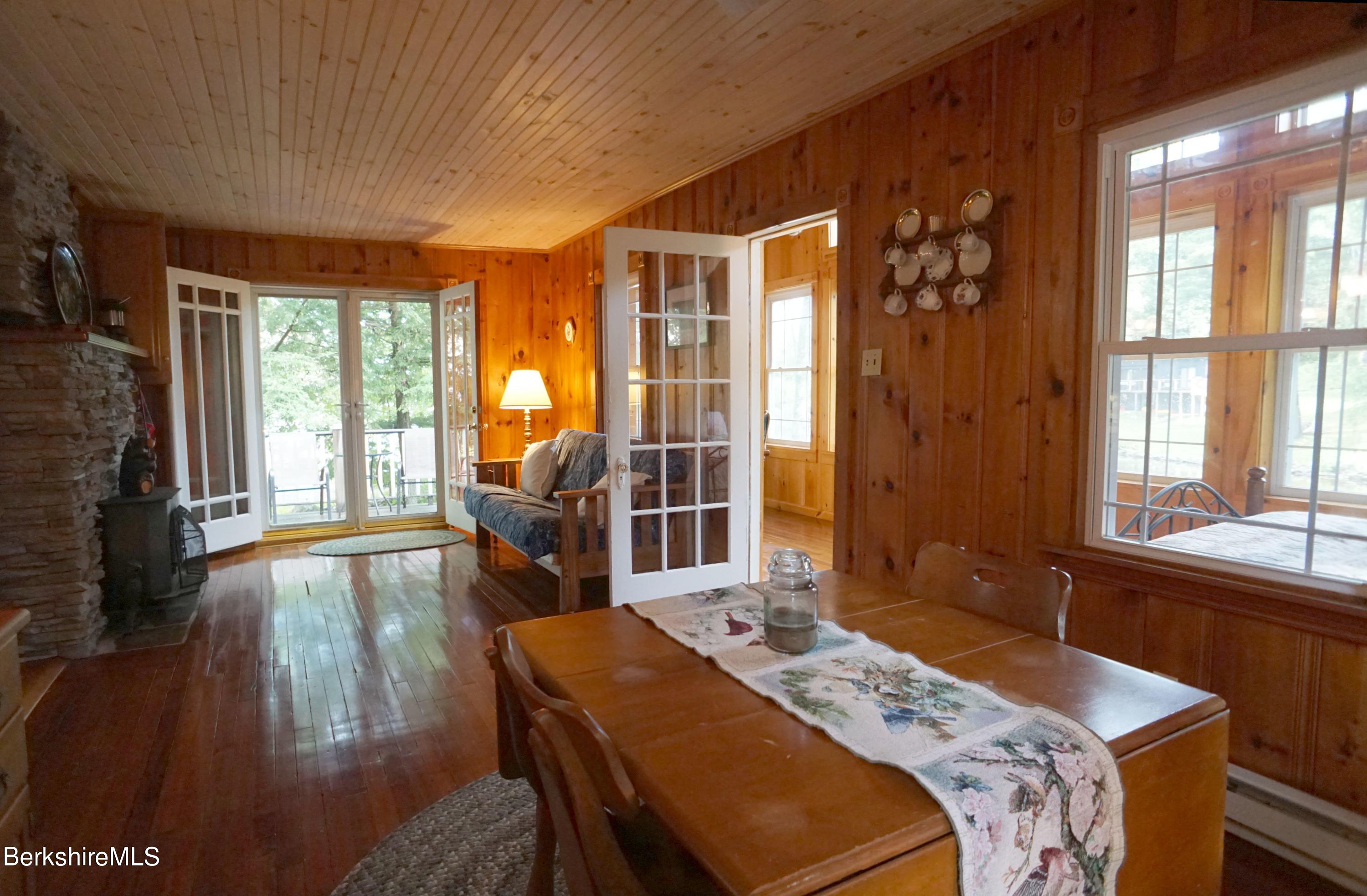 5 South Gate Island Road Otis, MA 01029 - Photo 17 of 38 a bed sitting in a bedroom next to a window