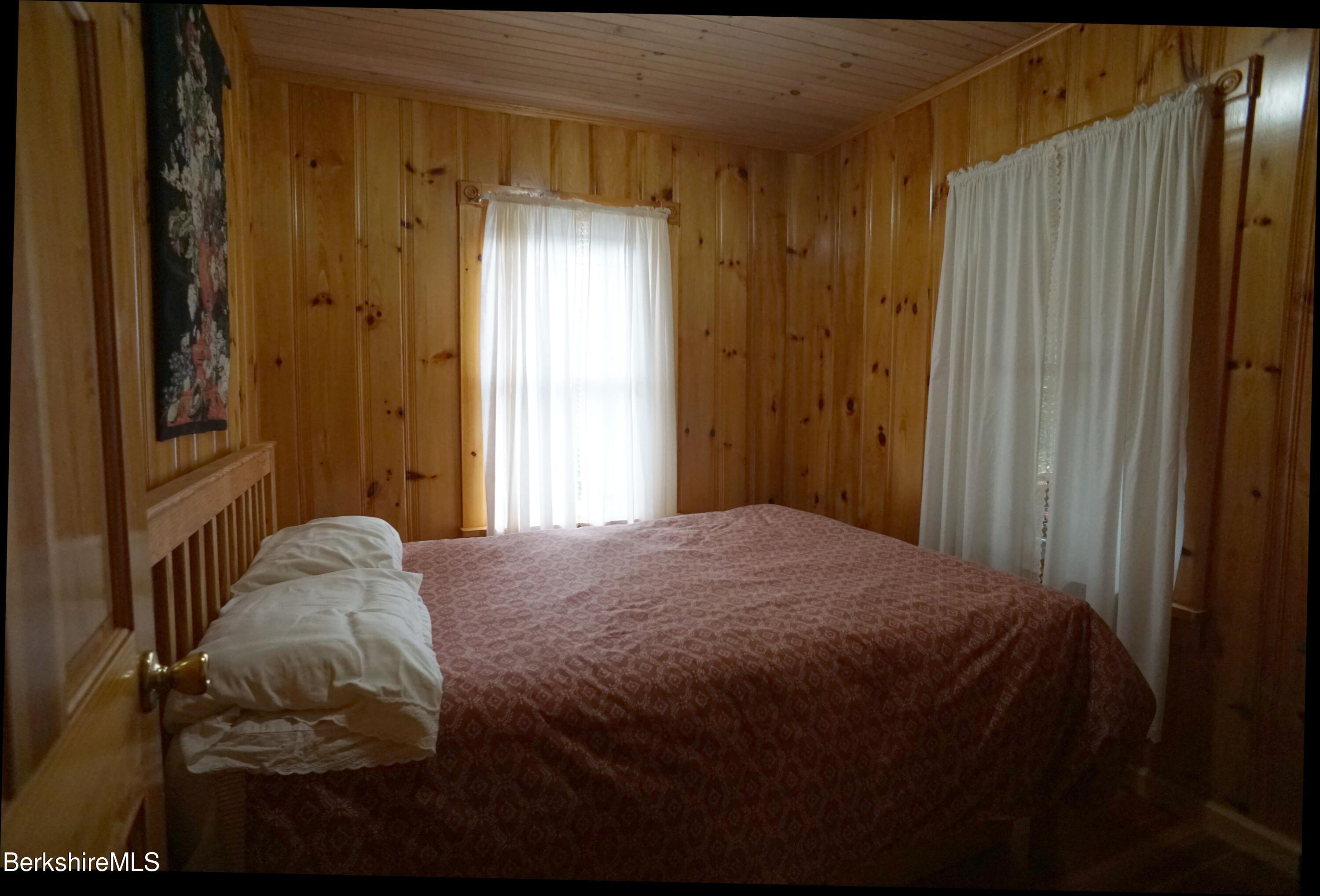 5 South Gate Island Road Otis, MA 01029 - Photo 25 of 38 a bedroom with a bed and a window