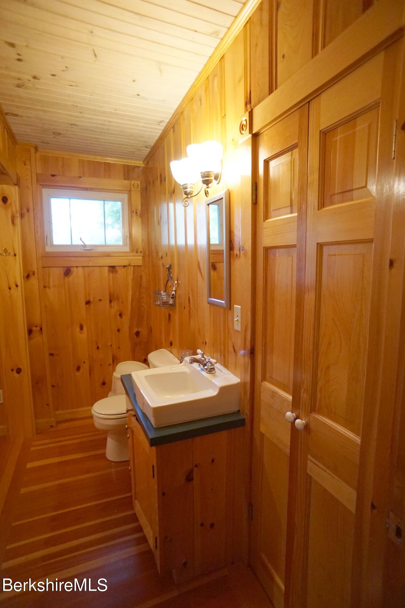 5 South Gate Island Road Otis, MA 01029 - Photo 27 of 38 a bathroom with a sink a toilet and shower