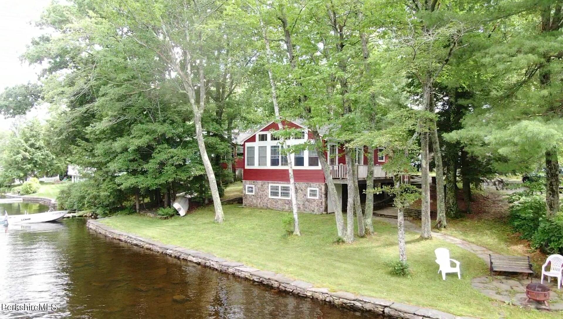 5 South Gate Island Road Otis, MA 01029 - Photo 32 of 38 swimming pool with table and chairs