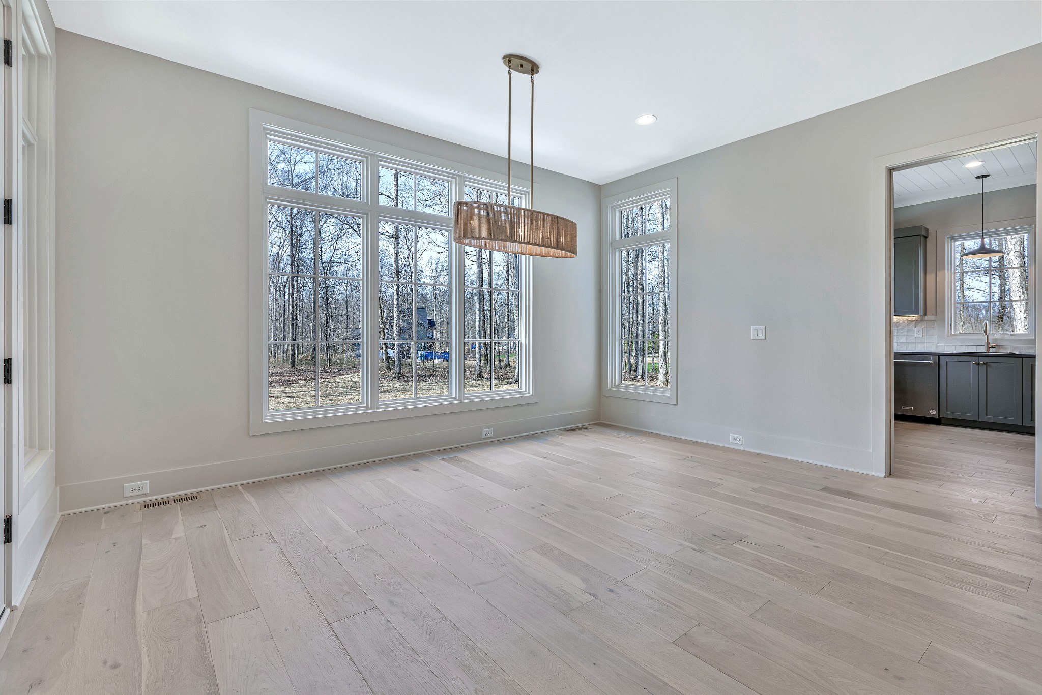 5025 Cobbler Ridge Road Franklin, TN 37064 - Photo 13 of 34 a view of an empty room with wooden floor and a window