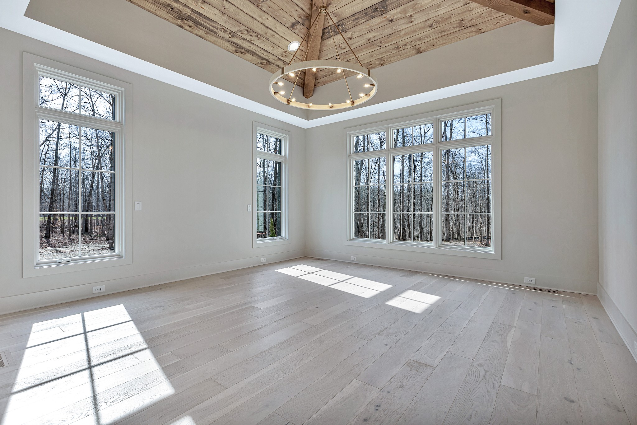 5025 Cobbler Ridge Road Franklin, TN 37064 - Photo 16 of 34 a view of an empty room with a window and wooden floor