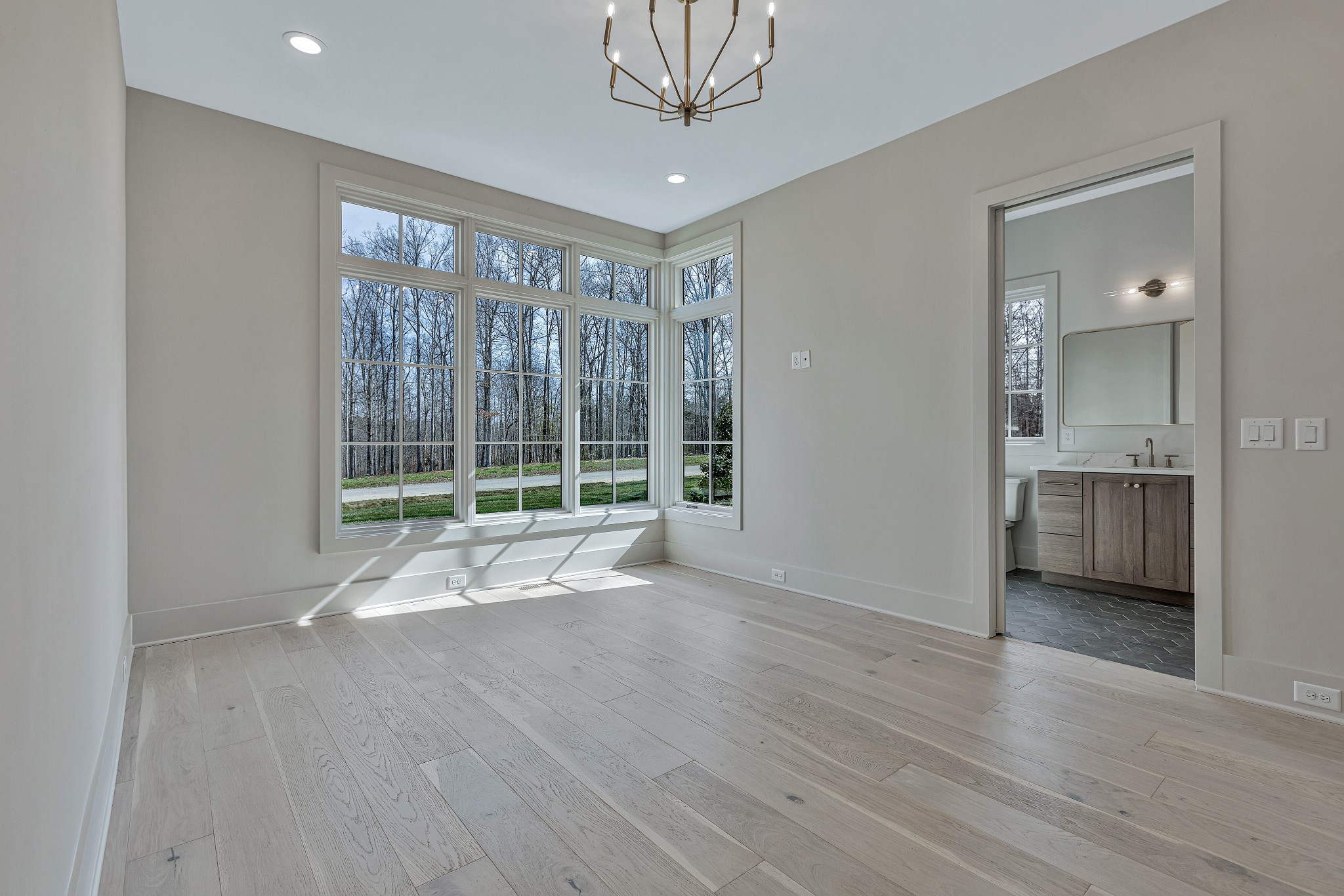 5025 Cobbler Ridge Road Franklin, TN 37064 - Photo 20 of 34 a view of an empty room with wooden floor and a window