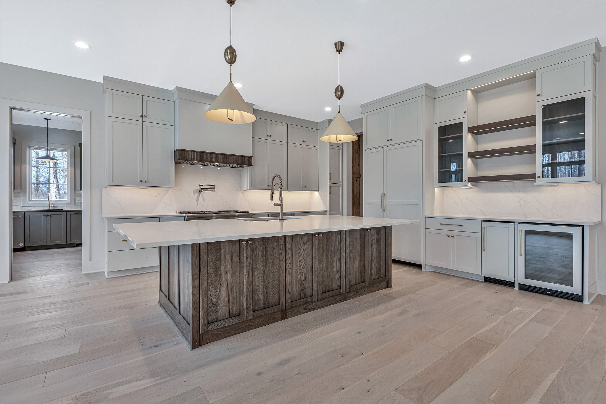 5025 Cobbler Ridge Road Franklin, TN 37064 - Photo 8 of 34 a large kitchen with kitchen island a sink stainless steel appliances and cabinets