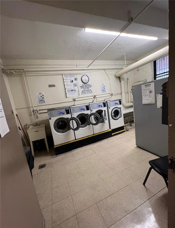1237 Avenue Z, Unit 1V Brooklyn, NY 11235 - Photo 19 of 20 a utility room with washer and dryer