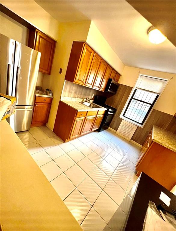1237 Avenue Z, Unit 1V Brooklyn, NY 11235 - Photo 2 of 20 a bathroom with a sink and a mirror