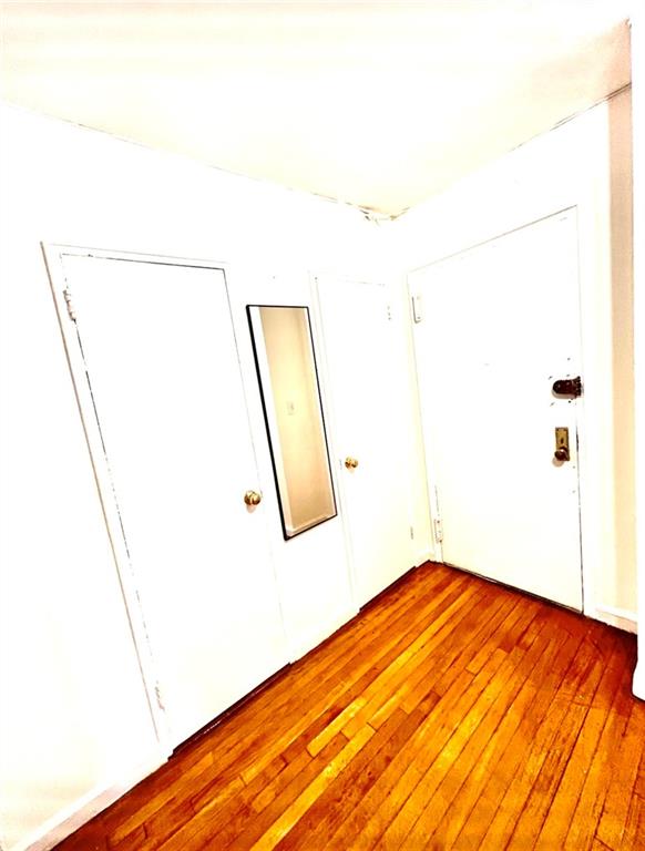 1237 Avenue Z, Unit 1V Brooklyn, NY 11235 - Photo 8 of 20 a view of a room with wooden floor