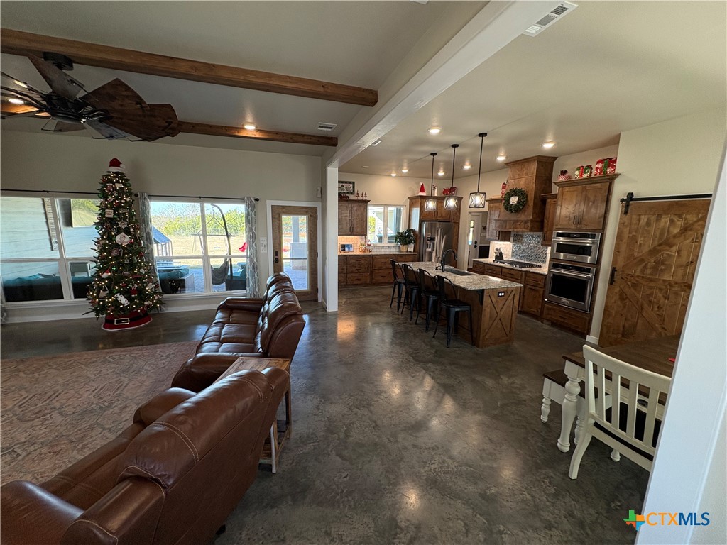 5851 Moccasin Bend Road Gatesville, TX 76528 - Photo 12 of 48 a living room with lots of furniture and kitchen view