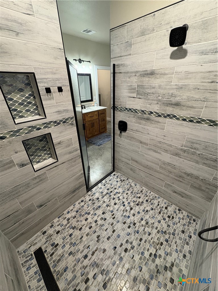 5851 Moccasin Bend Road Gatesville, TX 76528 - Photo 21 of 48 a bathroom with a shower