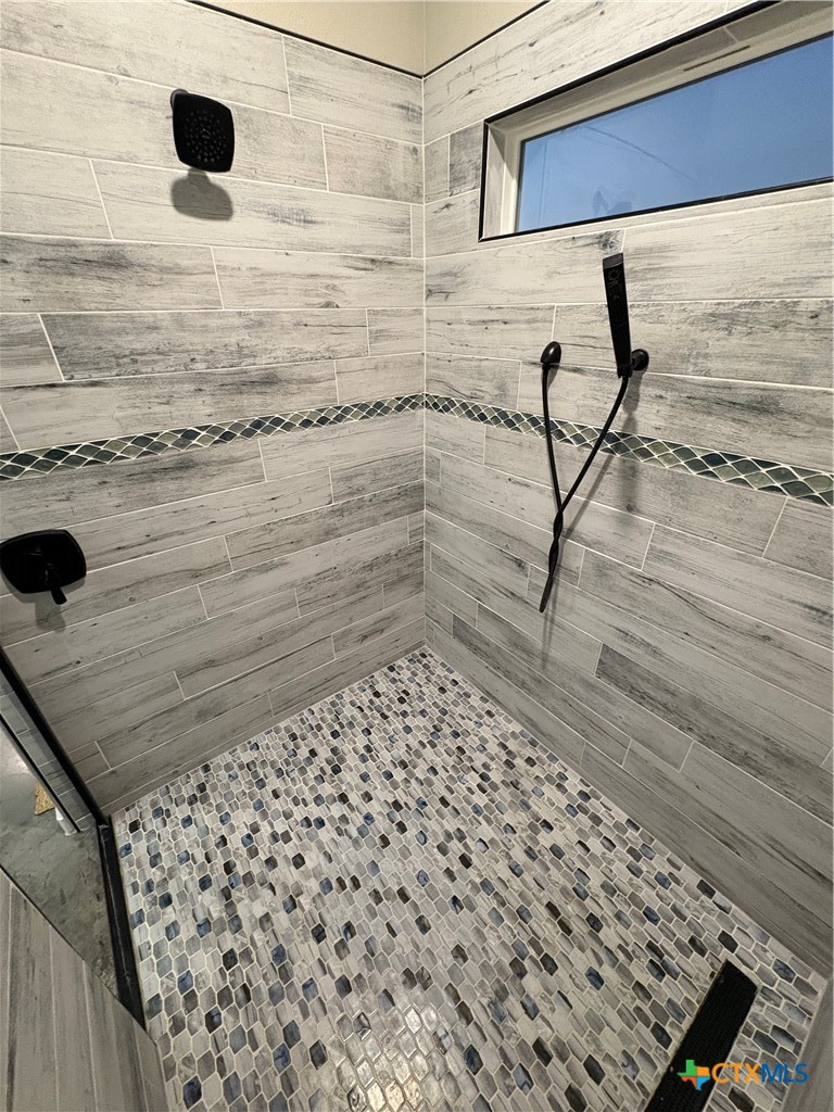 5851 Moccasin Bend Road Gatesville, TX 76528 - Photo 22 of 48 a bathroom with a shower