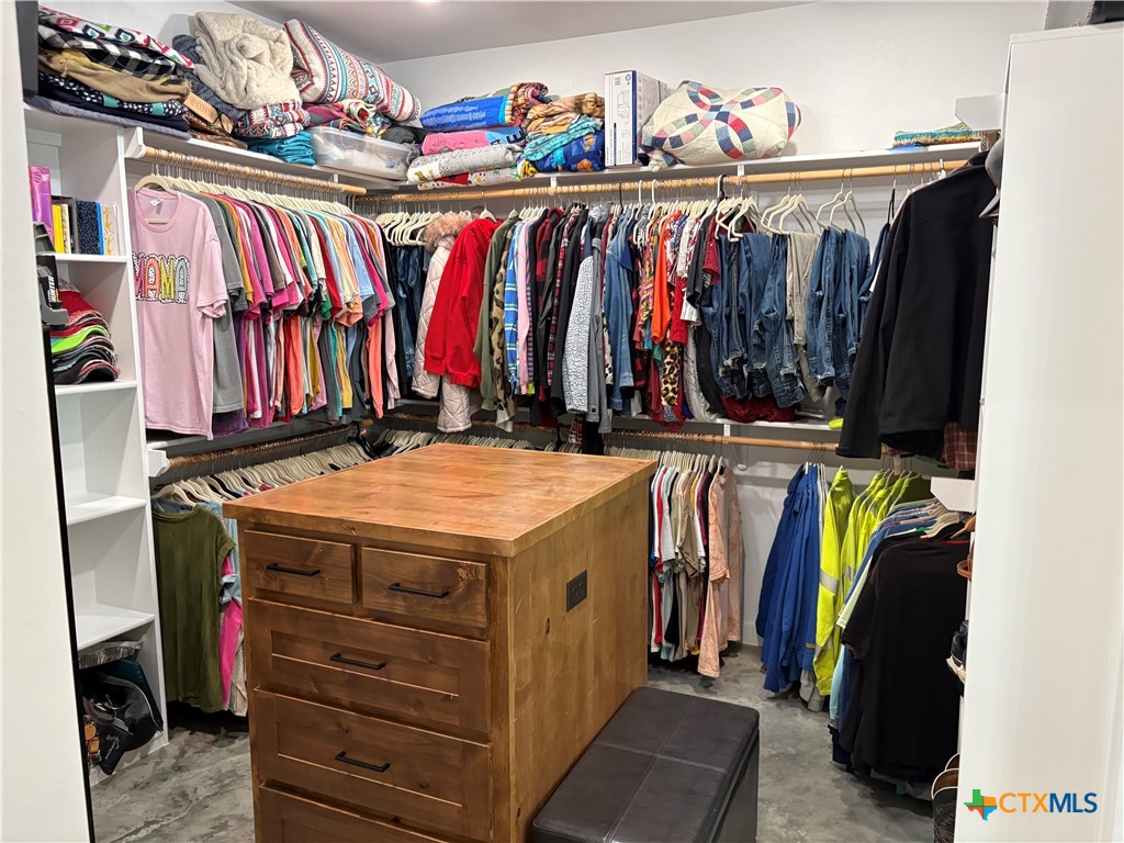 5851 Moccasin Bend Road Gatesville, TX 76528 - Photo 25 of 48 a view of walk in closet with clothes