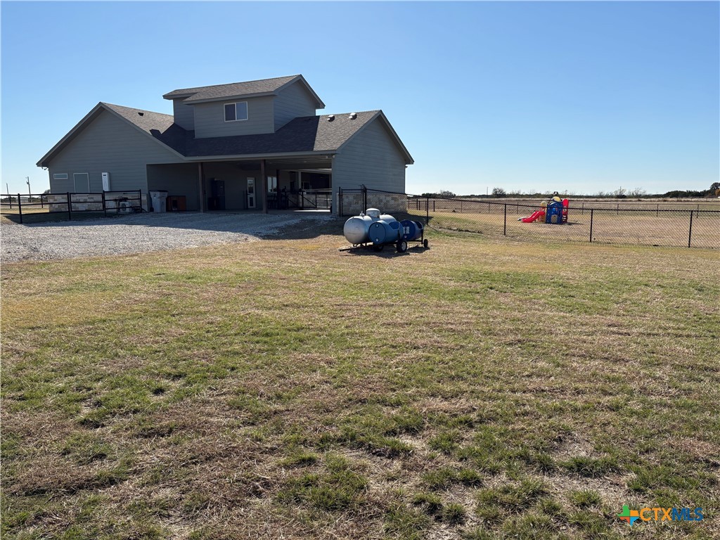 5851 Moccasin Bend Road Gatesville, TX 76528 - Photo 5 of 48 Side view of carport and propane tank.