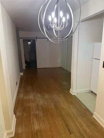 an empty room with wooden floor