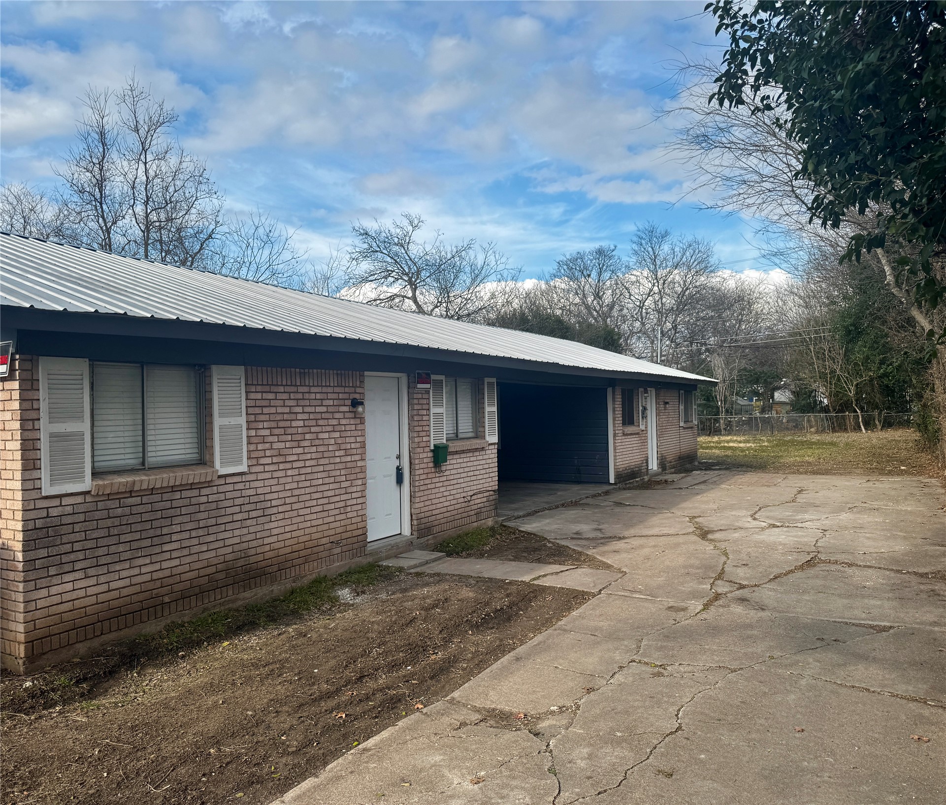 202 West N Loop Boulevard, Unit B Austin, TX 78751 - Photo 2 of 7 a front view of a house with a yard