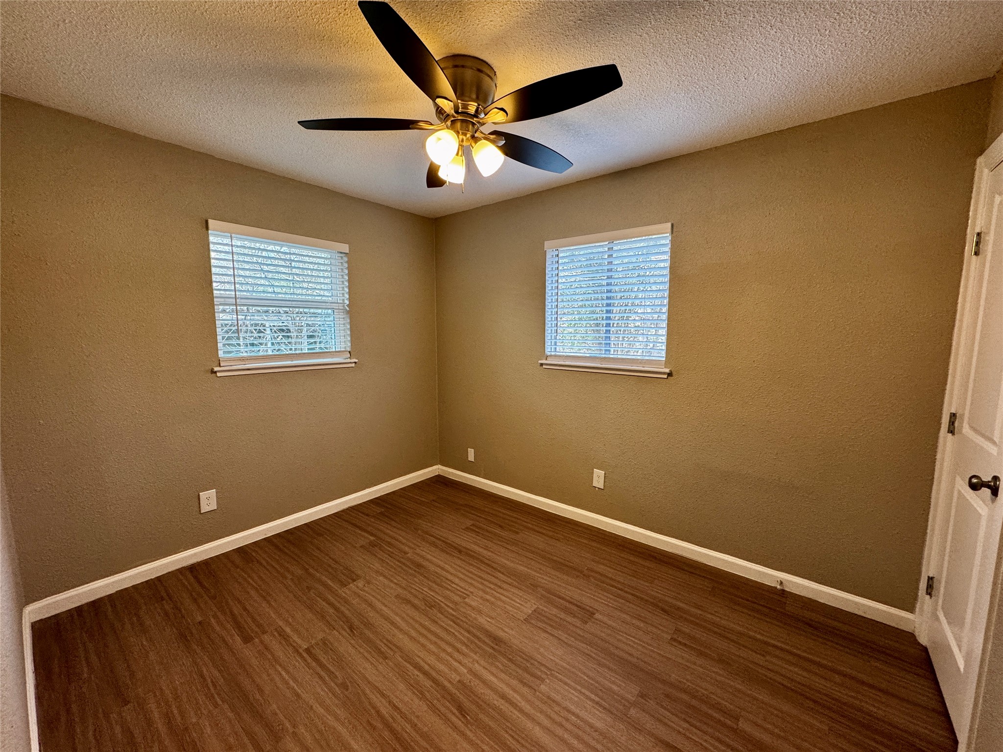 202 West N Loop Boulevard, Unit B Austin, TX 78751 - Photo 6 of 7 a view of an empty room with wooden floor