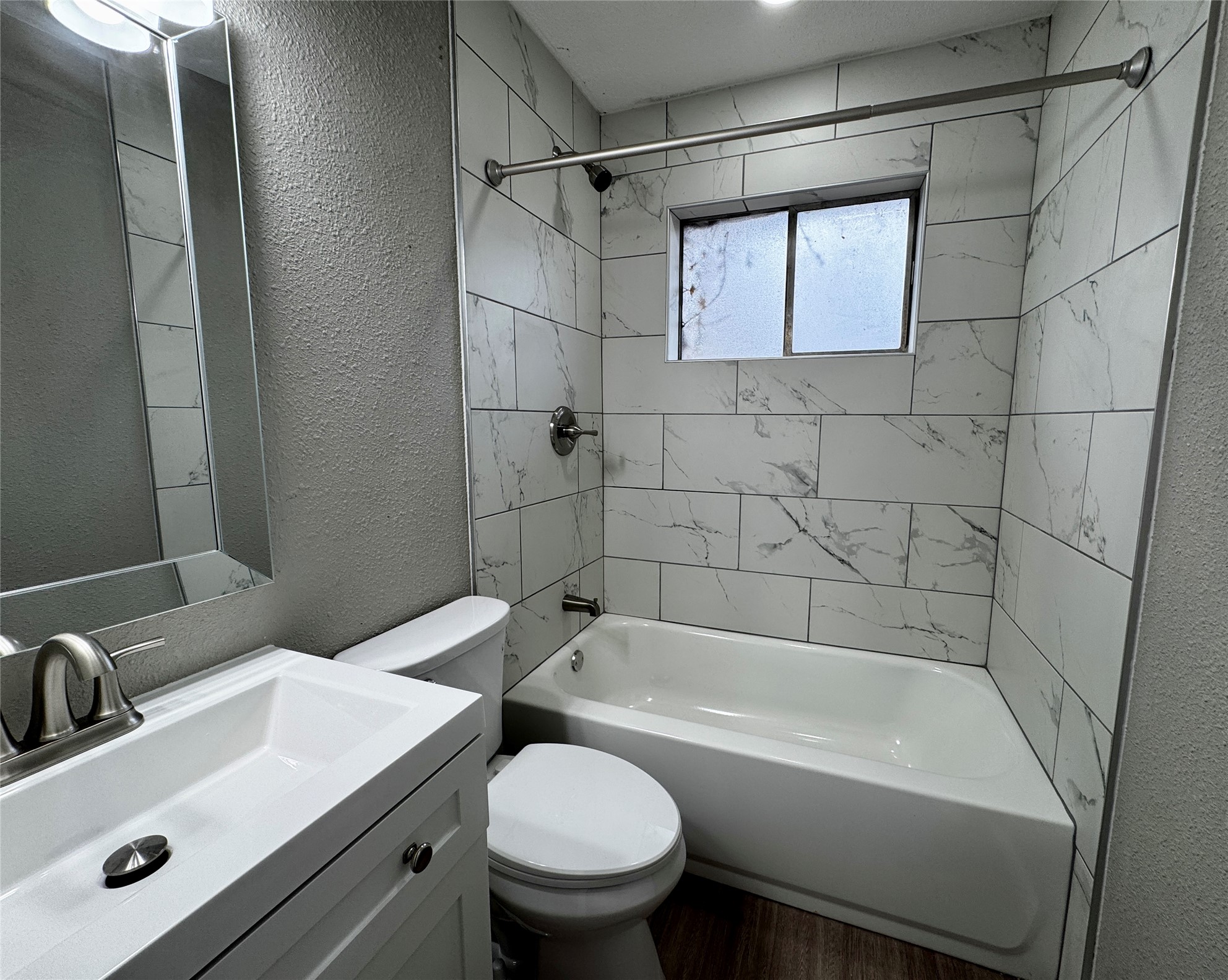 202 West N Loop Boulevard, Unit B Austin, TX 78751 - Photo 7 of 7 a bathroom with a sink mirror toilet and bathtub