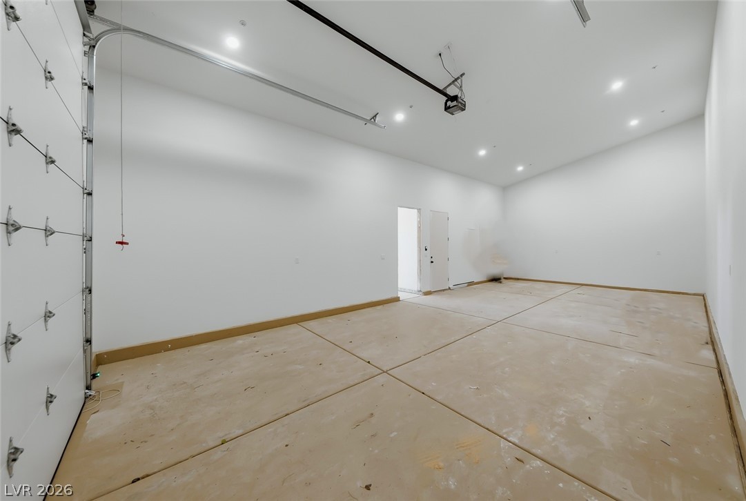 1140 Julie Road Henderson, NV 89002 - Photo 62 of 71 1140 JULIE RD HENDERSON NV 89002 Ample garage space with concrete flooring provides functional storage and utility.