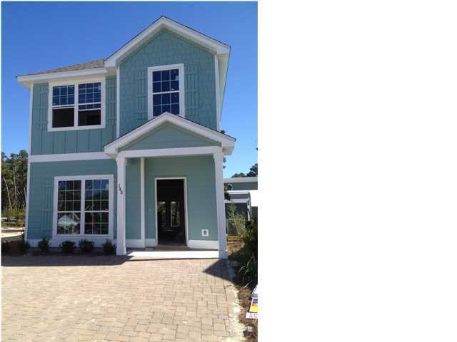 148 Grayling Way Inlet Beach, FL 32461 - Photo 1 of 1 a view of a brick house with many windows