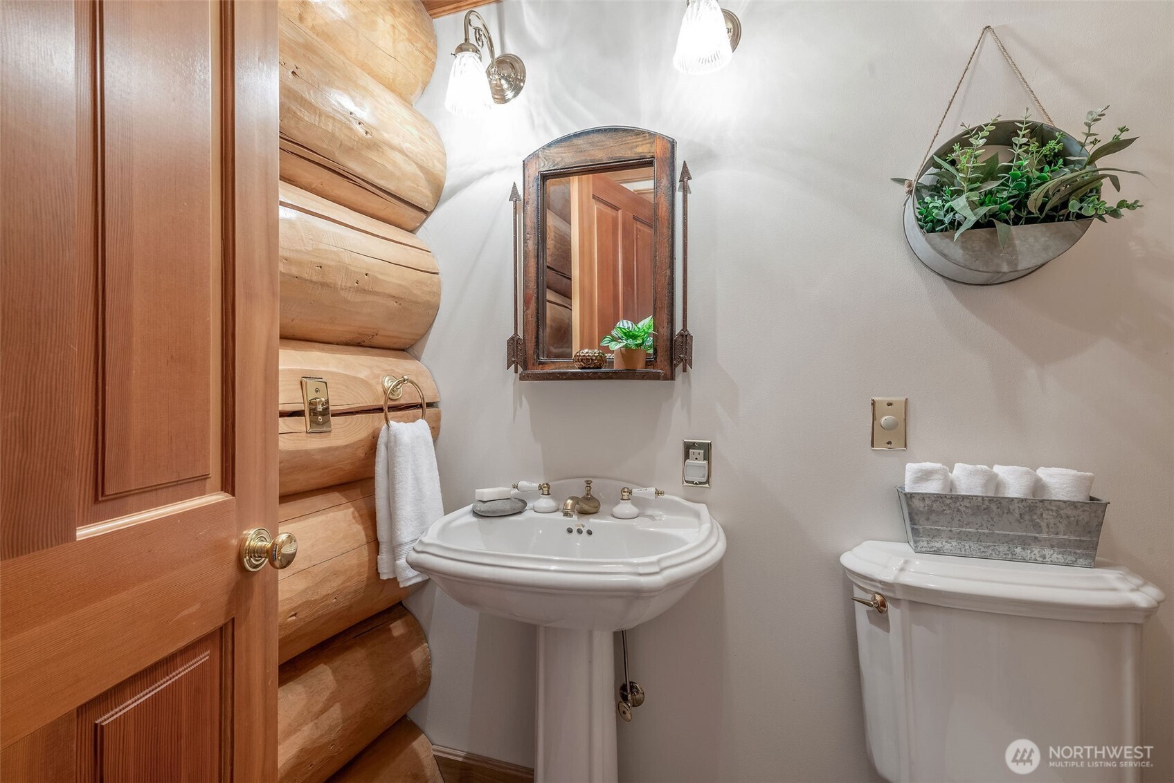 53 Combs Place Port Townsend, WA 98368 - Photo 24 of 40 a bathroom with a sink a toilet and mirror