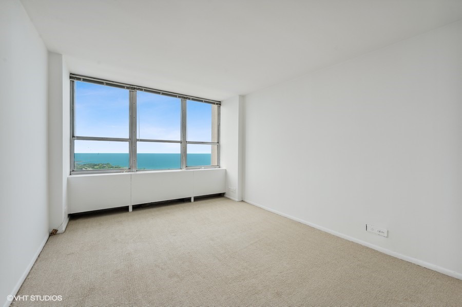 655 West Irving Park Road, Unit 5202 Chicago, IL 60613 - Photo 12 of 26 a view of an empty room with a window