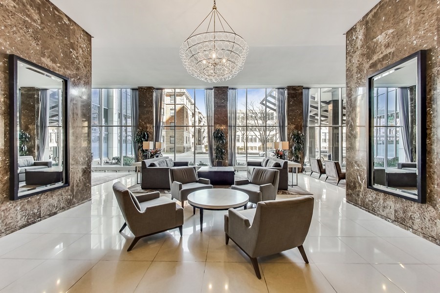 655 West Irving Park Road, Unit 5202 Chicago, IL 60613 - Photo 15 of 26 a living room with furniture and a large window