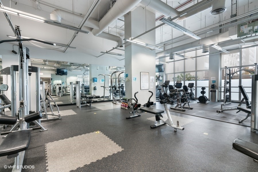 655 West Irving Park Road, Unit 5202 Chicago, IL 60613 - Photo 19 of 26 a view of a room with gym equipment