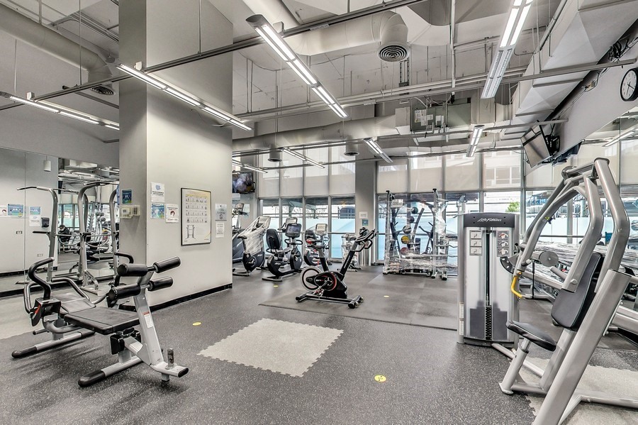 655 West Irving Park Road, Unit 5202 Chicago, IL 60613 - Photo 20 of 26 a view of a room with gym equipment