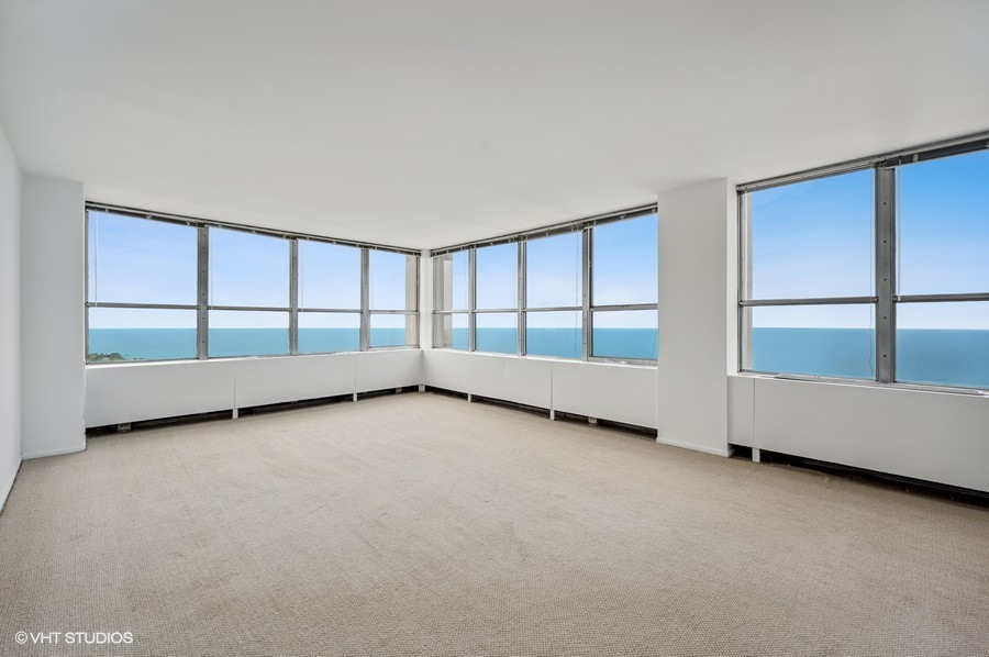 655 West Irving Park Road, Unit 5202 Chicago, IL 60613 - Photo 2 of 26 an empty room with a large window