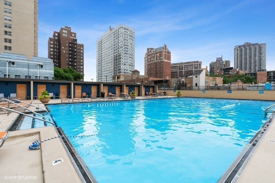 655 West Irving Park Road, Unit 5202 Chicago, IL 60613 - Photo 25 of 26 a view of swimming pool of water with tall buildings