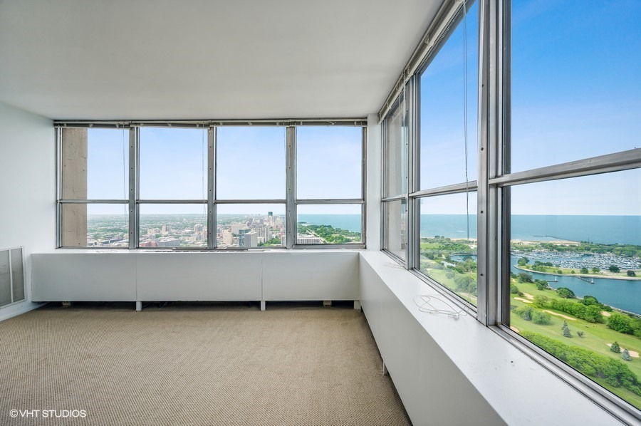 655 West Irving Park Road, Unit 5202 Chicago, IL 60613 - Photo 3 of 26 a bathroom with a large window and a bathtub