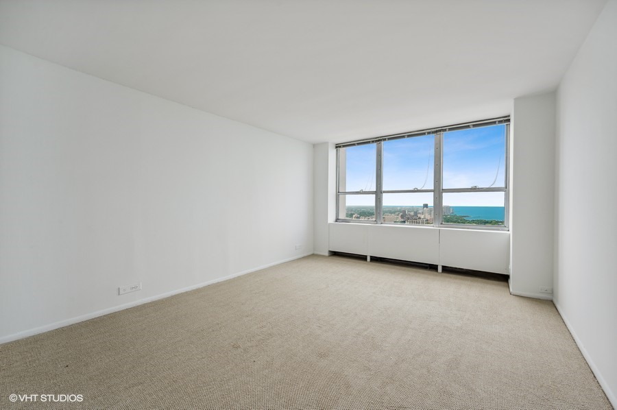 655 West Irving Park Road, Unit 5202 Chicago, IL 60613 - Photo 8 of 26 a view of an empty room with a window
