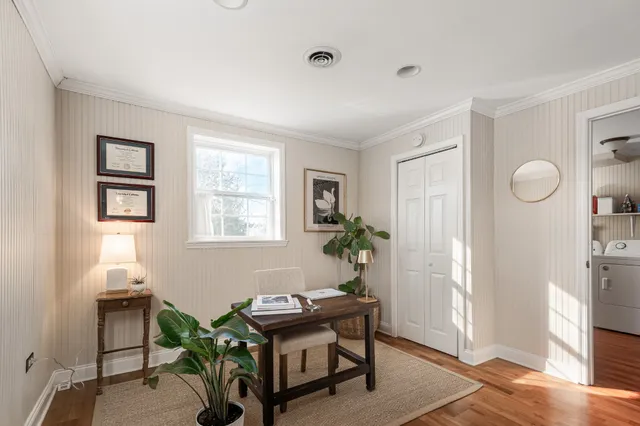 a workspace with furniture and window