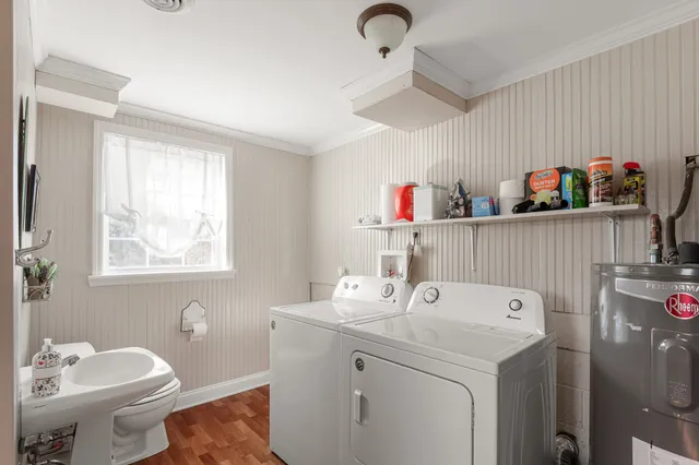 a utility room with a sink dryer and washer