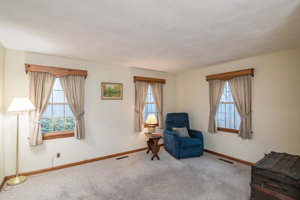 88 Buffam Road Pelham, MA 01002 - Photo 13 of 42 a living room with furniture and a window