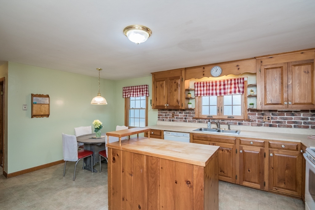 88 Buffam Road Pelham, MA 01002 - Photo 15 of 42 a kitchen that has a sink and a stove in it
