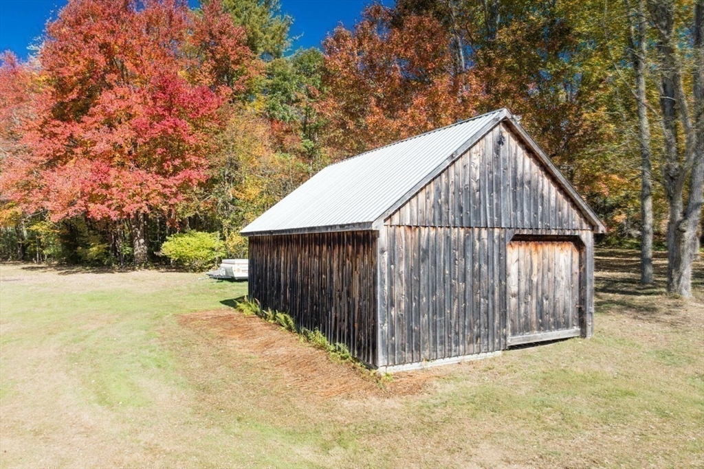 88 Buffam Road Pelham, MA 01002 - Photo 38 of 42 a view of backyard with small cabin