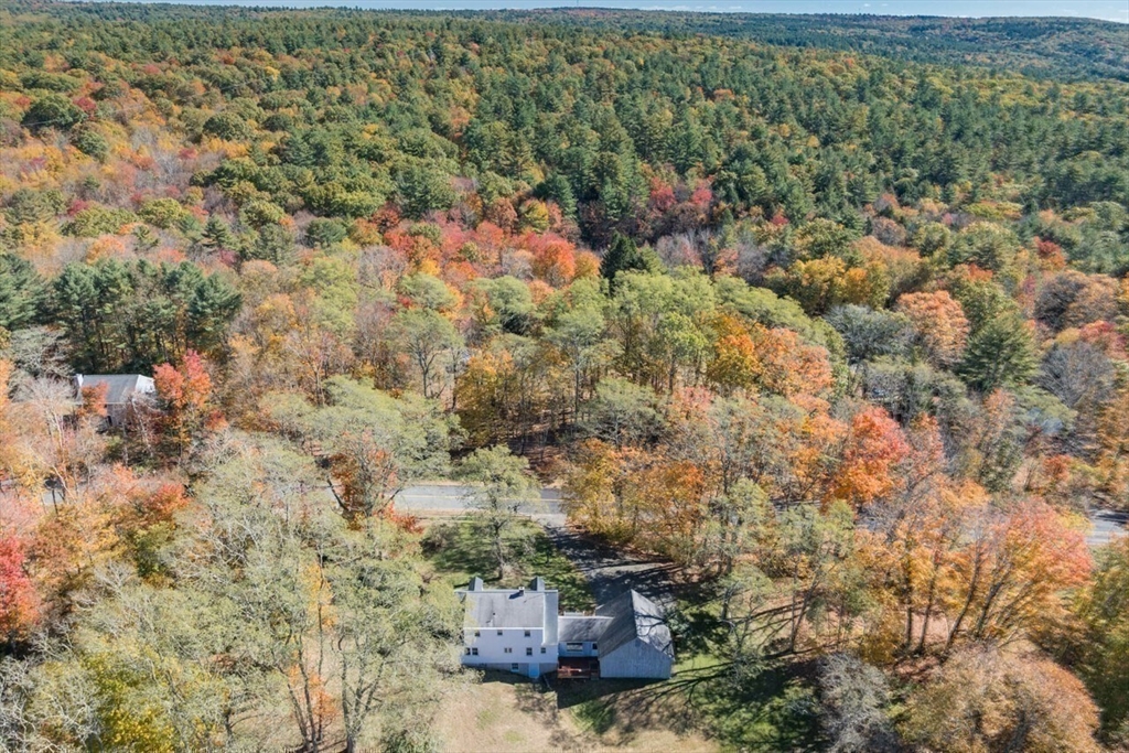 88 Buffam Road Pelham, MA 01002 - Photo 41 of 42 a view of a city with lush green forest