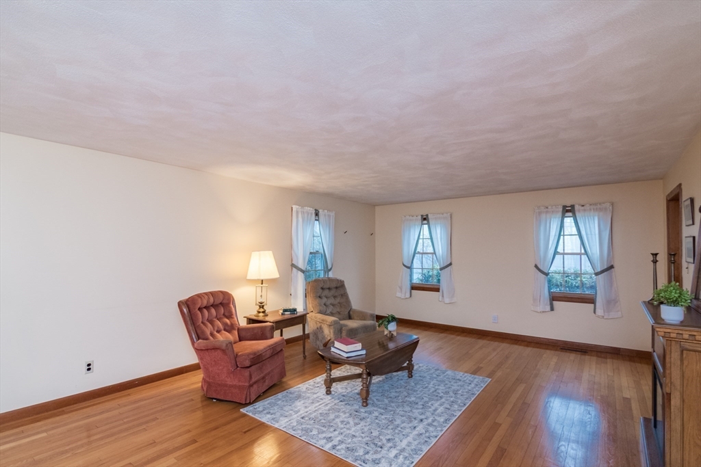 88 Buffam Road Pelham, MA 01002 - Photo 9 of 42 a living room with furniture and wooden floor