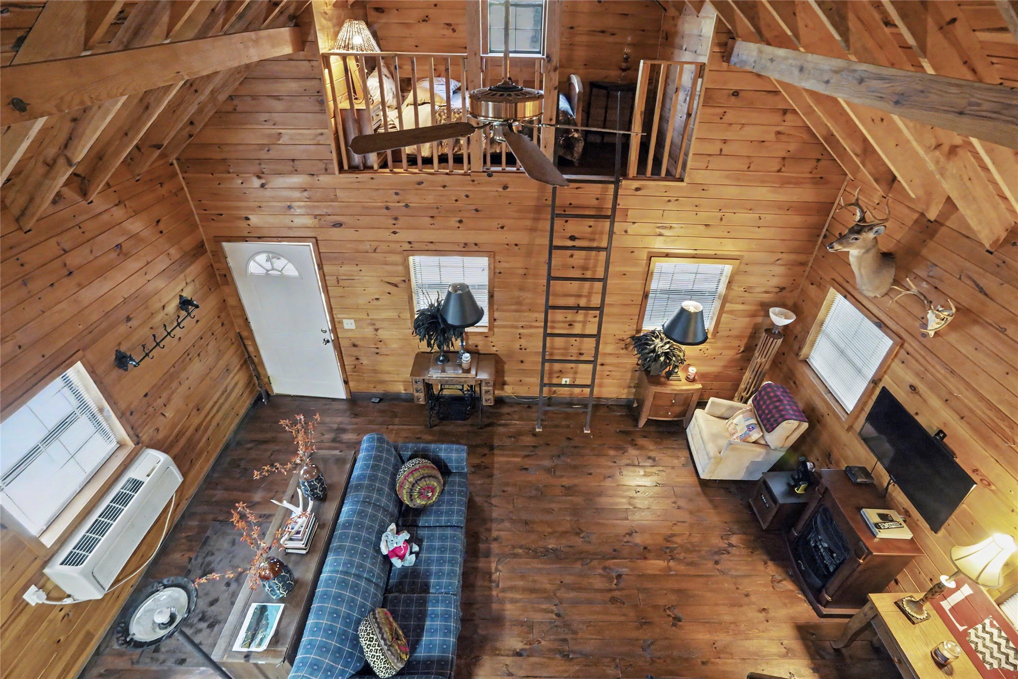 46420 South 590 Road Jay, OK 74346 - Photo 19 of 63 Wood-finish flooring with full wood-paneled walls and a vaulted ceiling